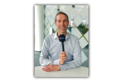 A picture of Roland holding the microphone.